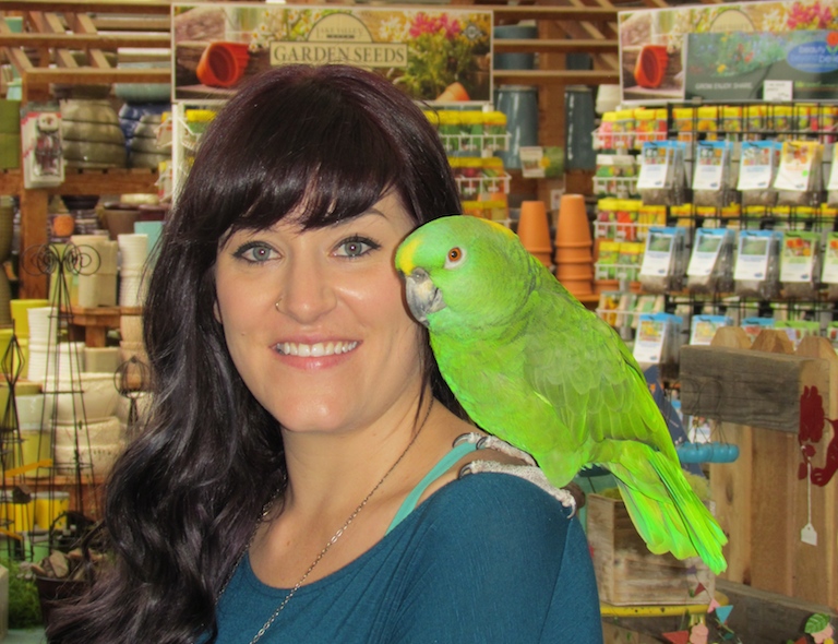 Lindy and Emily at the seed racks in the greenhouse.
