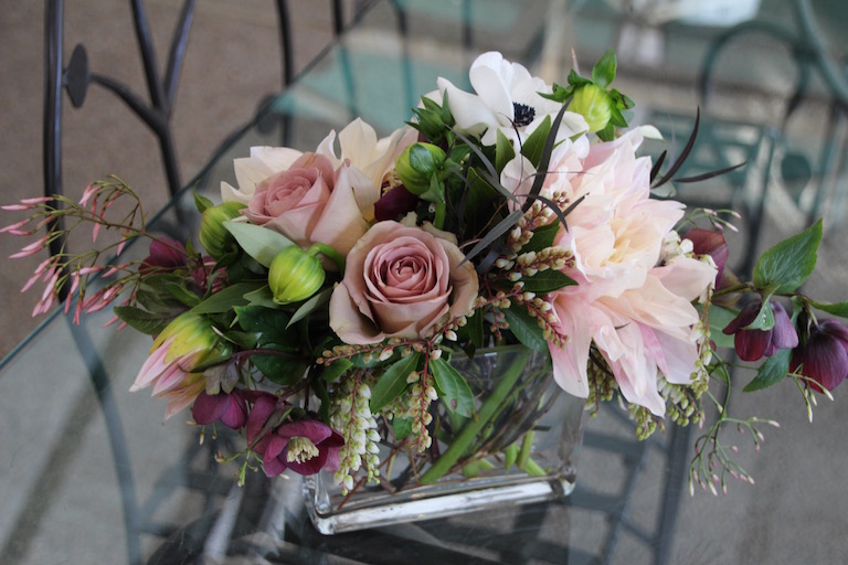 Centerpieces for the wedding table with magenta hellebores