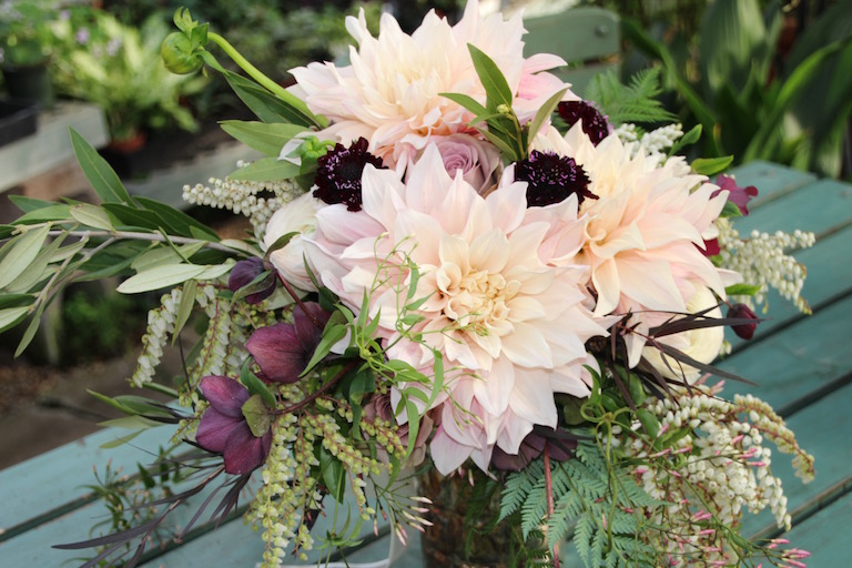 Bridal bouquet with peach dahlias, magenta scabies, antique roses and hellebores