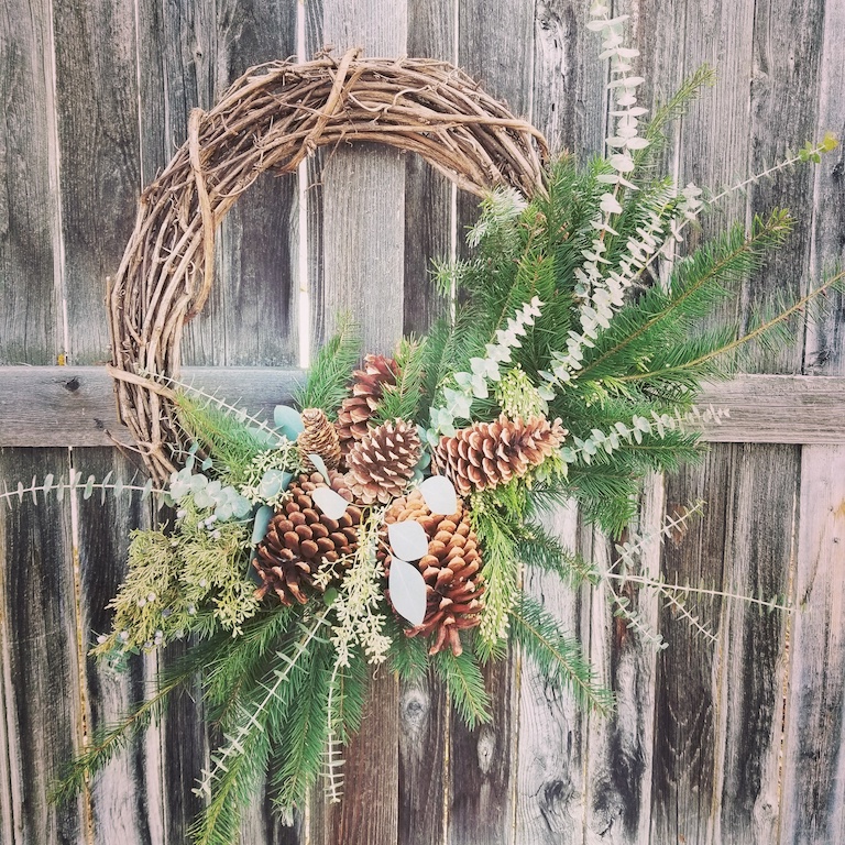 Willow wreath with pinecones and evergreen
