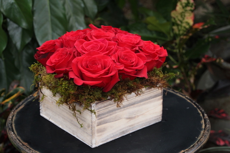 Red Roses arranged in a rectangular wooden box