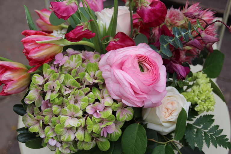 Green and pink hydrangeas with pink ranunculus